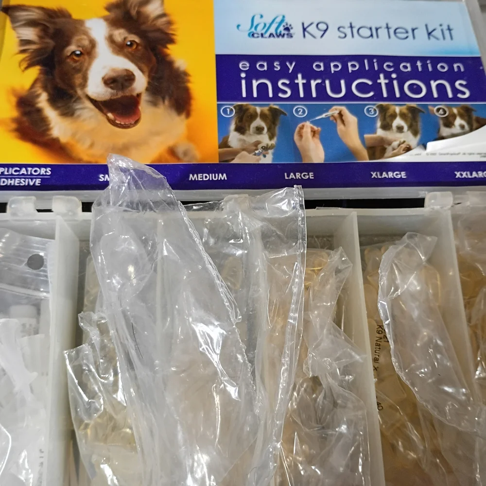 Soft Claws Pet Nail Caps in Yellow and Blue Packaging